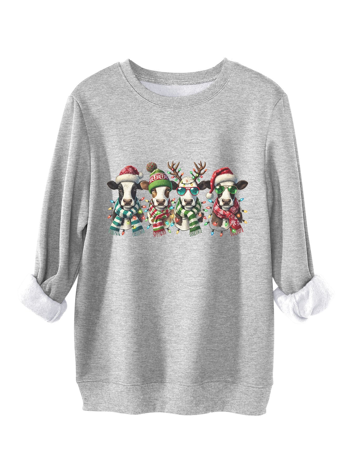 Four cows wearing hats scarves thick hoodies