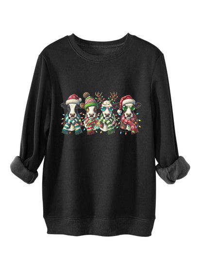 Four cows wearing hats scarves thick hoodies