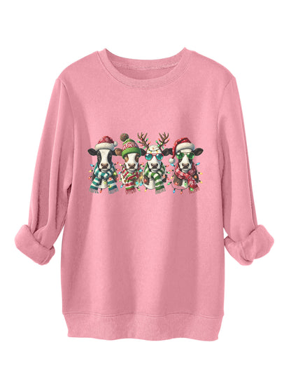 Four cows wearing hats scarves thick hoodies