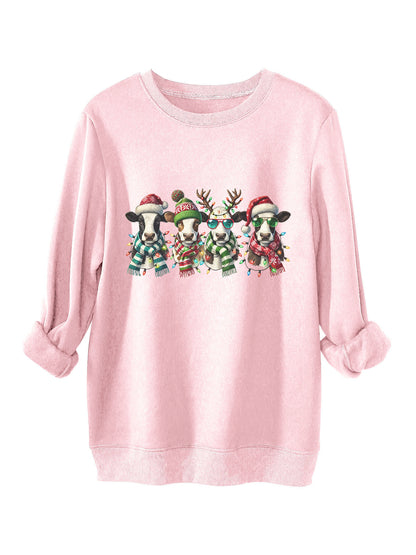 Four cows wearing hats scarves thick hoodies