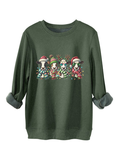 Four cows wearing hats scarves thick hoodies