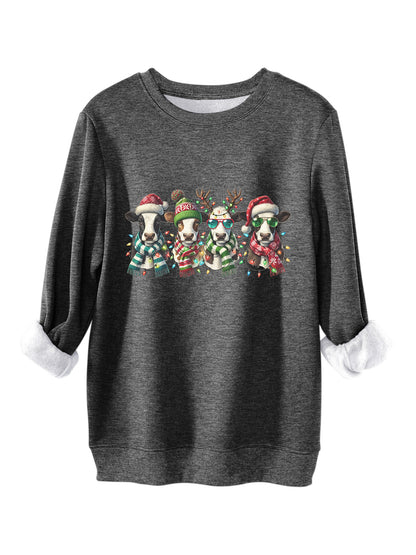 Four cows wearing hats scarves thick hoodies