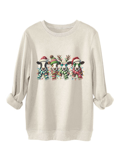 Four cows wearing hats scarves thick hoodies