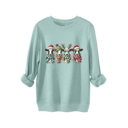 Four cows wearing hats scarves thick hoodies